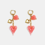 Earrings with dangling hearts on a chain