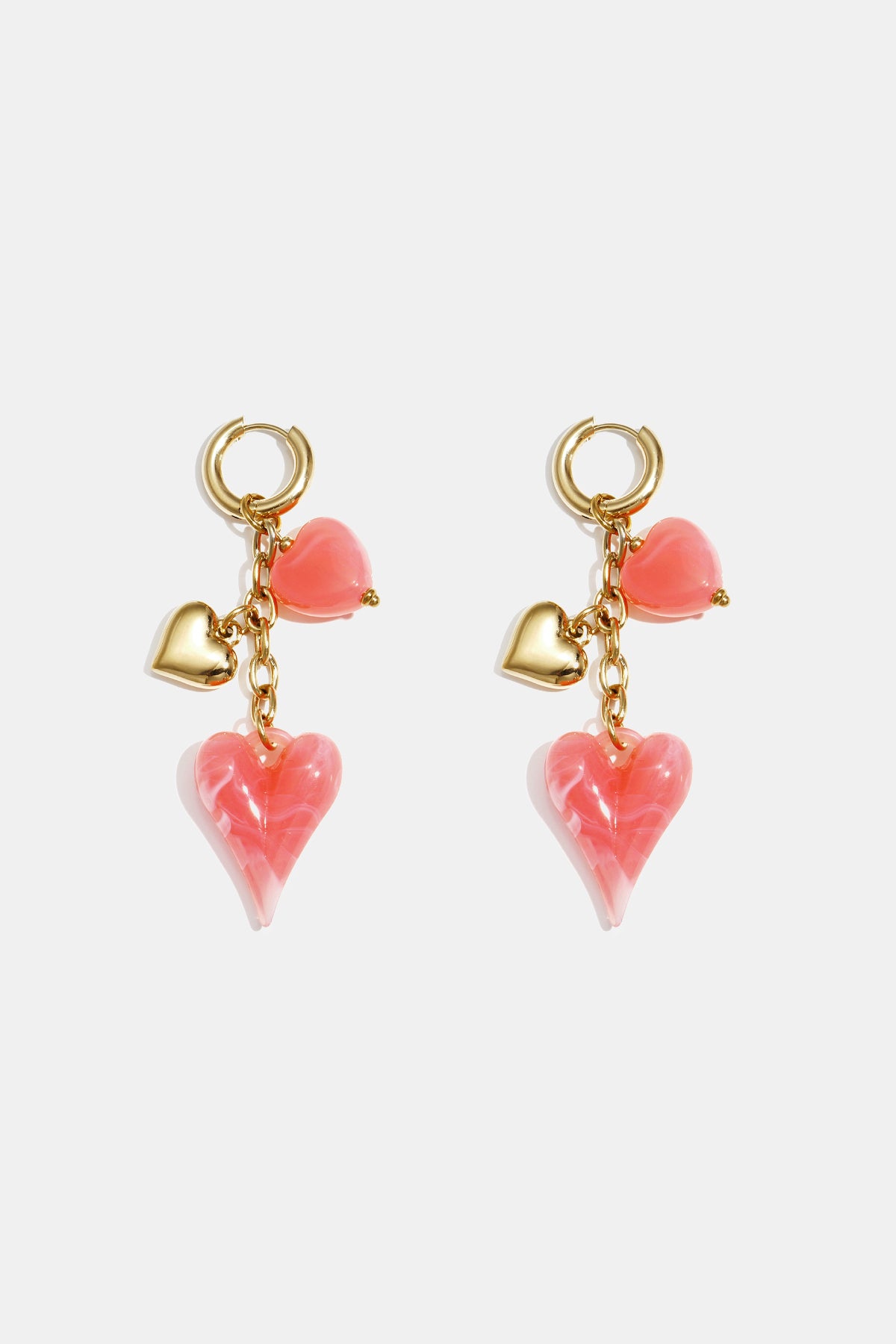 Earrings with dangling hearts on a chain
