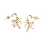 Heart-shaped earrings with hanging beads and charms