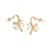 Heart-shaped earrings with hanging beads and charms