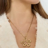 Necklace with hanging flower charm
