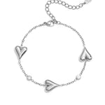 Bracelet with three solid hearts and stones