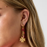 Small hoop earrings with hanging clover, beads and leaves
