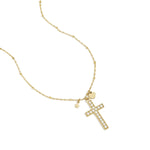 Necklace with decorated cross pendant and charms