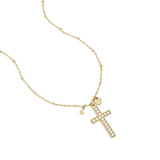 Necklace with decorated cross pendant and charms