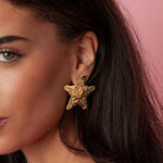 Dented star earrings