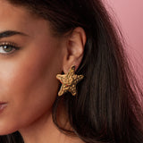 Dented star earrings