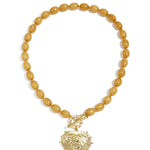 Bead necklace with front closure charm