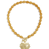 Bead necklace with front closure charm