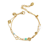 Bracelet with clover, beads and stones
