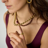 Linked necklace with gold and colored beads