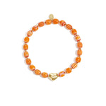 Beaded bracelet with heart-shaped centerpiece