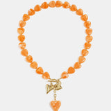 Bead necklace with hanging heart charms