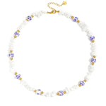 Necklaces with stone beads and white beads with blue flowers