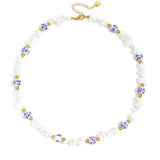 Necklaces with stone beads and white beads with blue flowers
